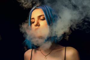 Woman exhales smoke with closed eyes, savoring the moment in serene enjoyment