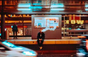 A man vaping CBD in the city