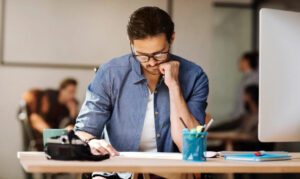 Man using CBD gummies to focus