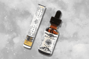 a vial of full spectrum CBD and a delta 8 cartage from Botany Farms hover above a grey smokey backdrop