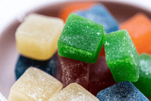 A close up shot of a pile of colorful Delta 10 gummies.