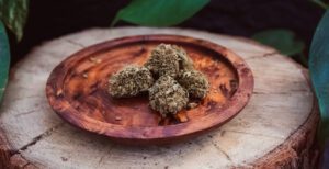 CBCV Flower nugs sitting on a wooden plate